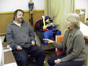 Nurse helping another cilent at the Augsburg Central Nursing Center.