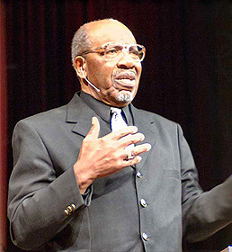 Picture of John Perkins speaking.