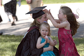 Picture of a student embracing her family.